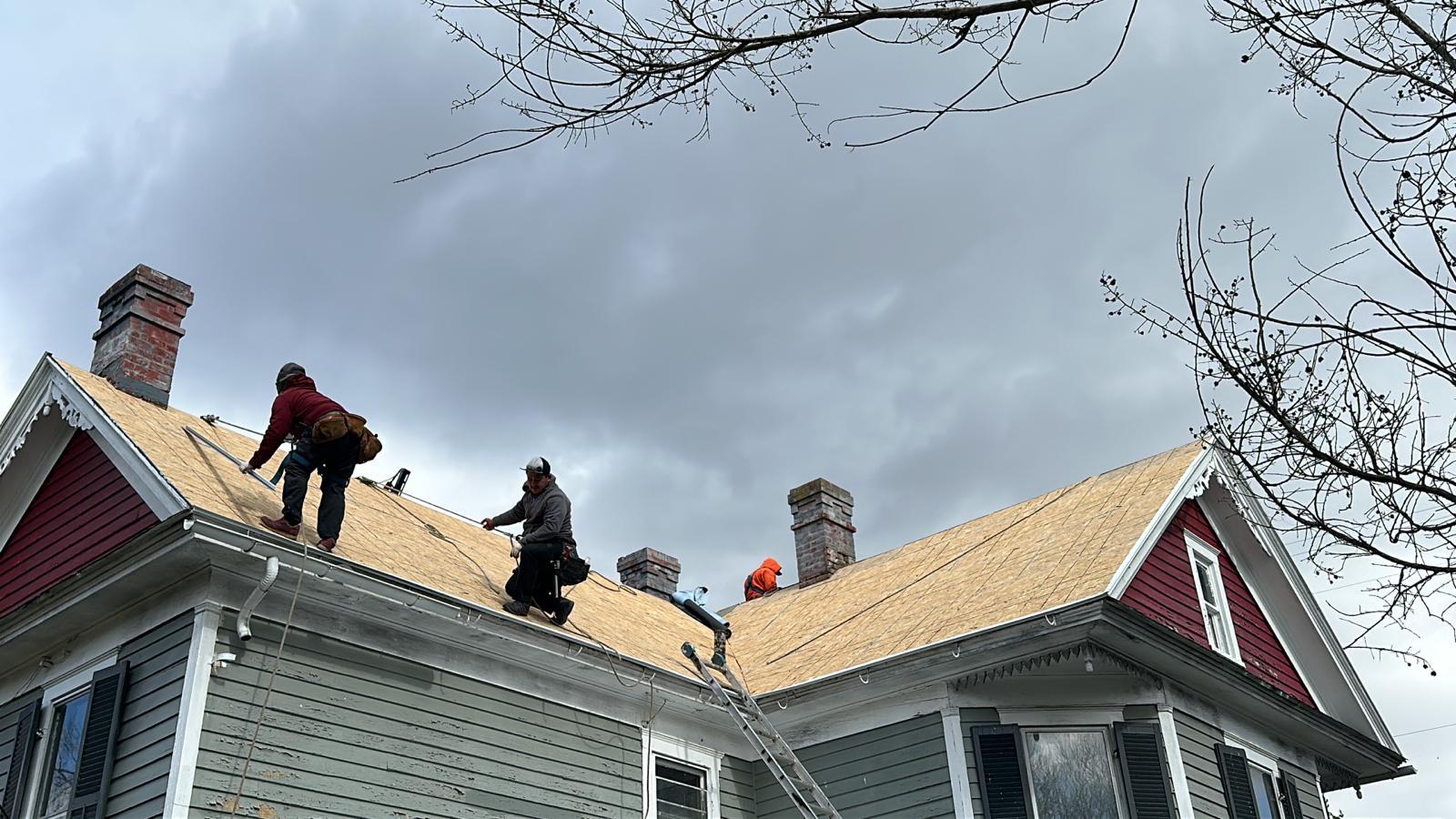 Roof installation crew on steep slope Victorian roof